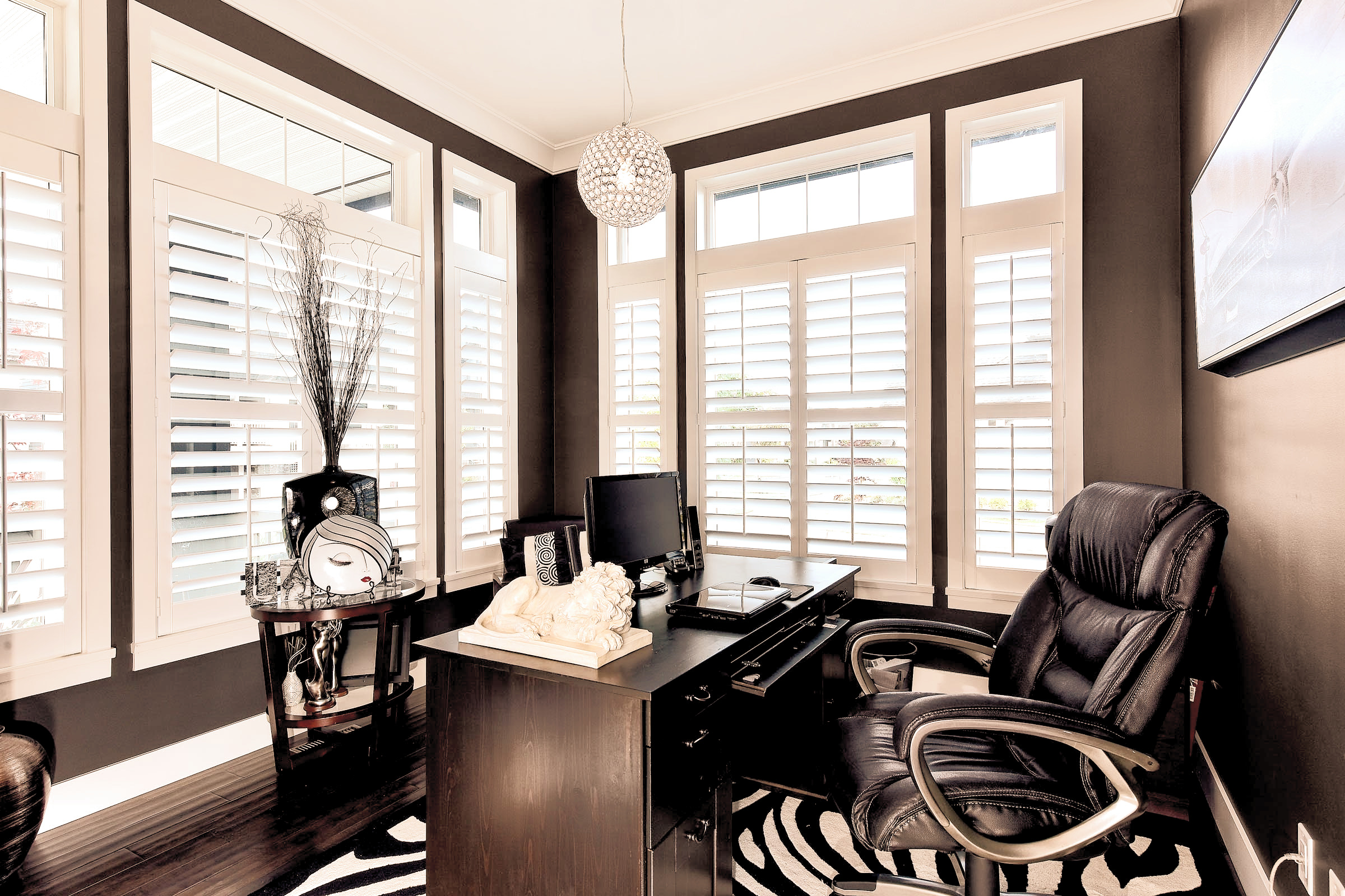Home office with white plantation shutters